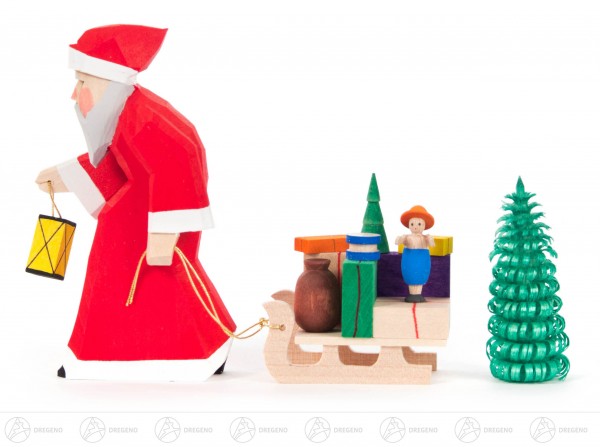 Weihnachtsmann geschnitzt mit Schlitten und Bäumchen